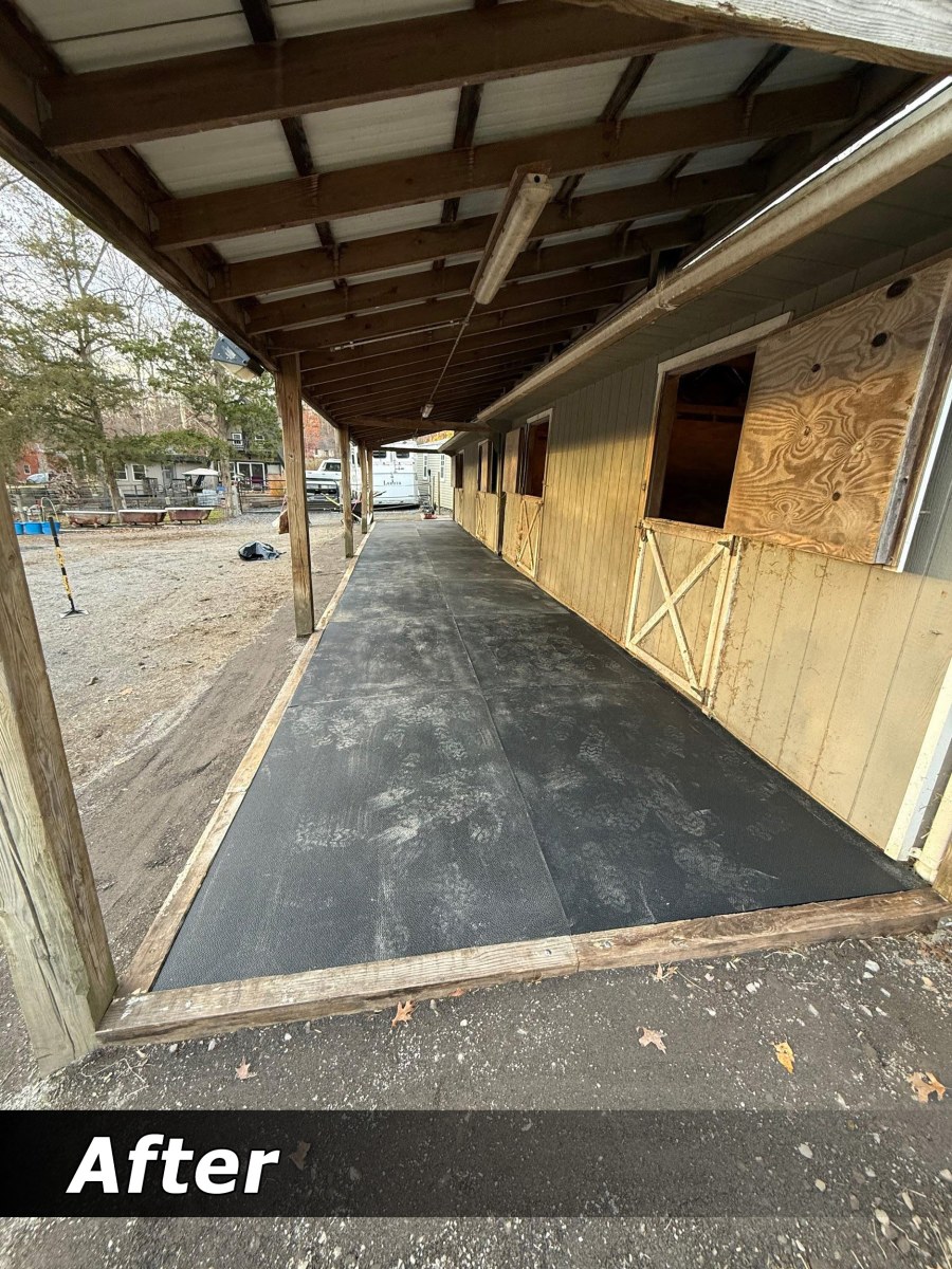 Barn aisle after mat re-leveling