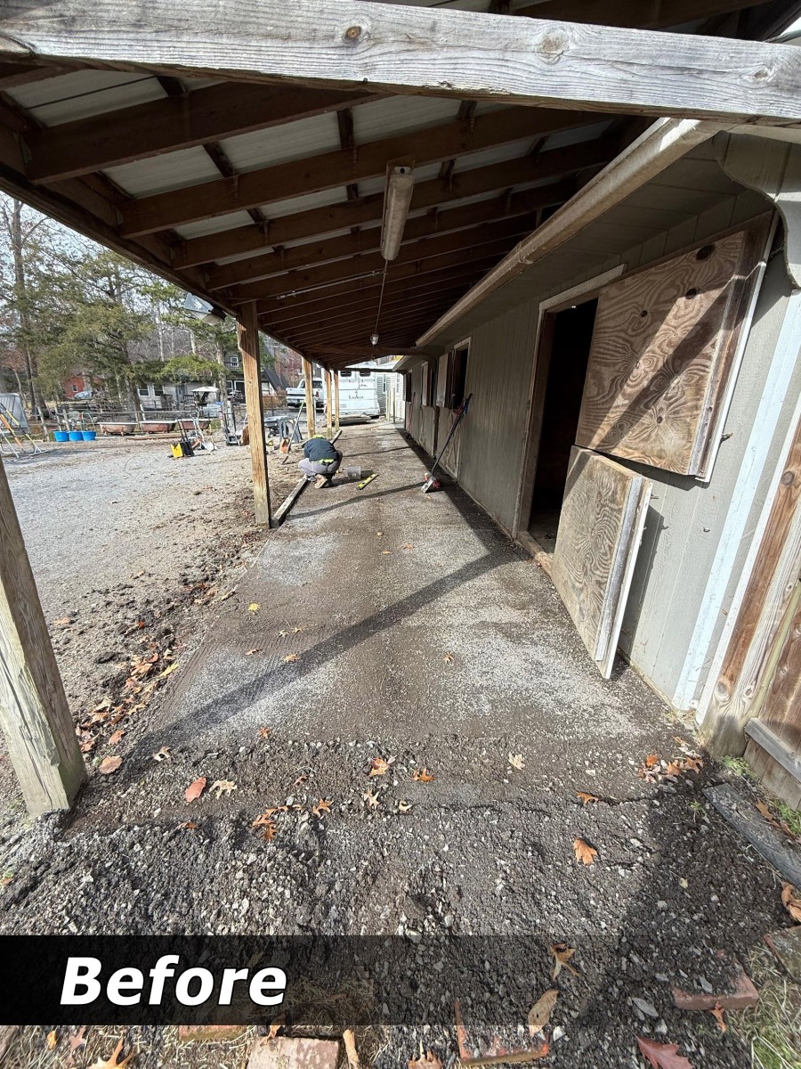 Barn aisle before mat re-leveling