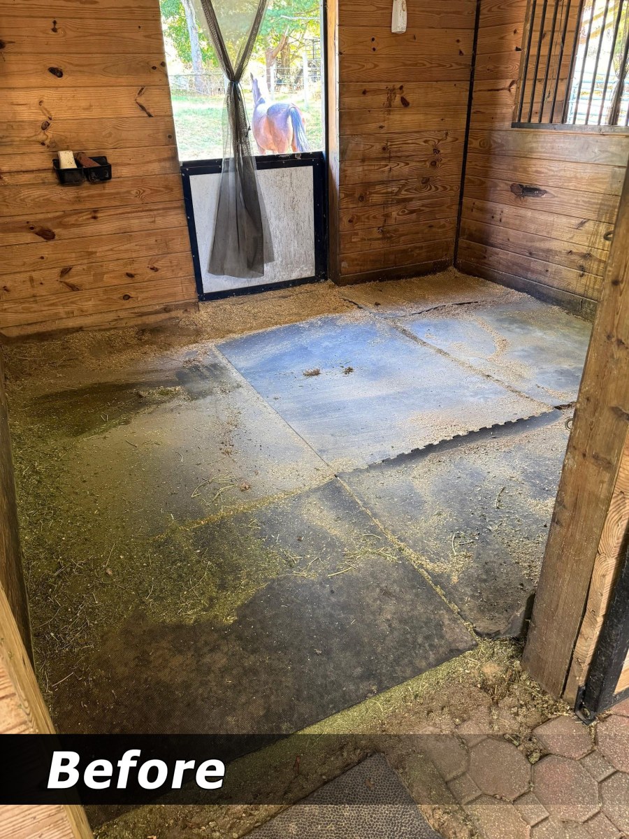Worn, uneven stall mats before re-leveling